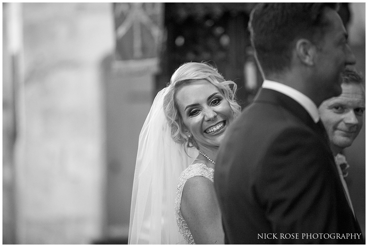  St Mary's church bride smiling during the wedding ceremony 