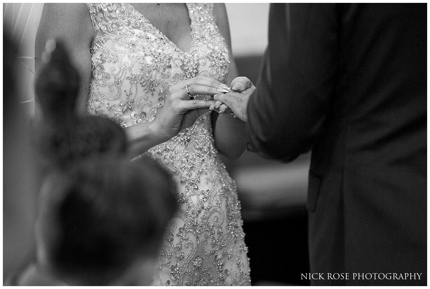  Bride and groom exchanging rings during a church wedding ceremony at St Mary's in Tickhill 