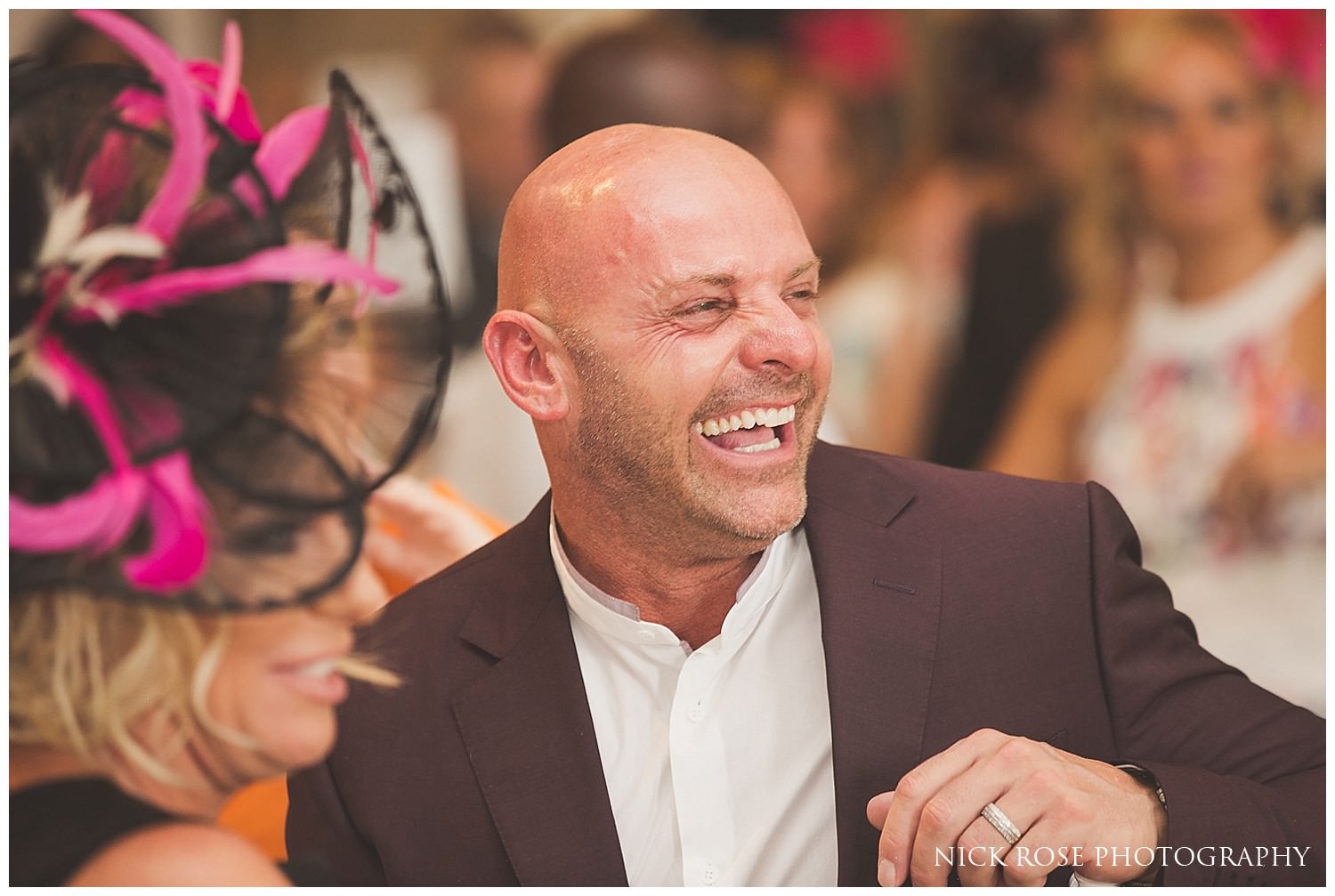  Guests laughing during the wedding speeches at Rudding Park Hotel 