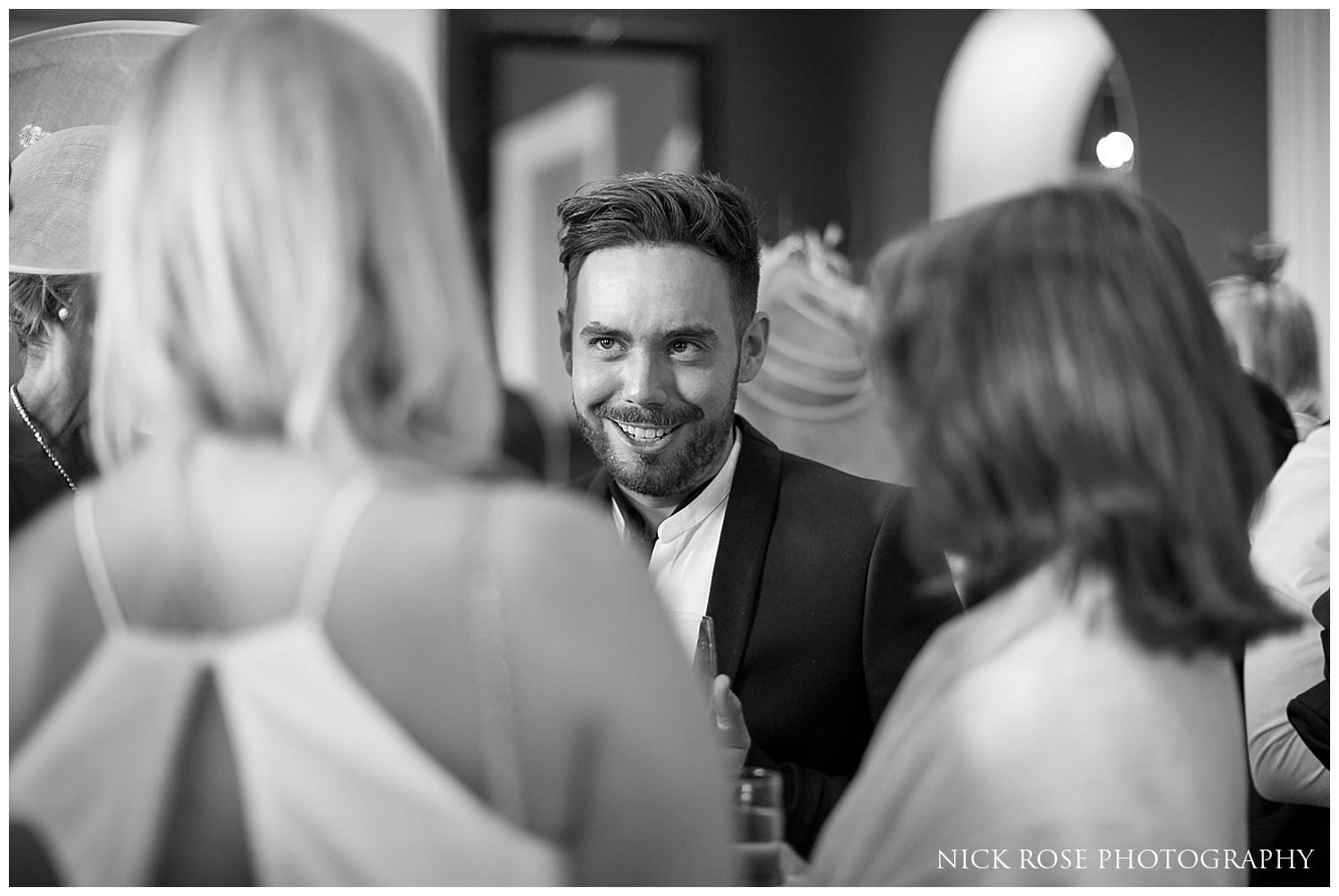  Guests mingling during a Rudding Park Hotel wedding in Harrogate 