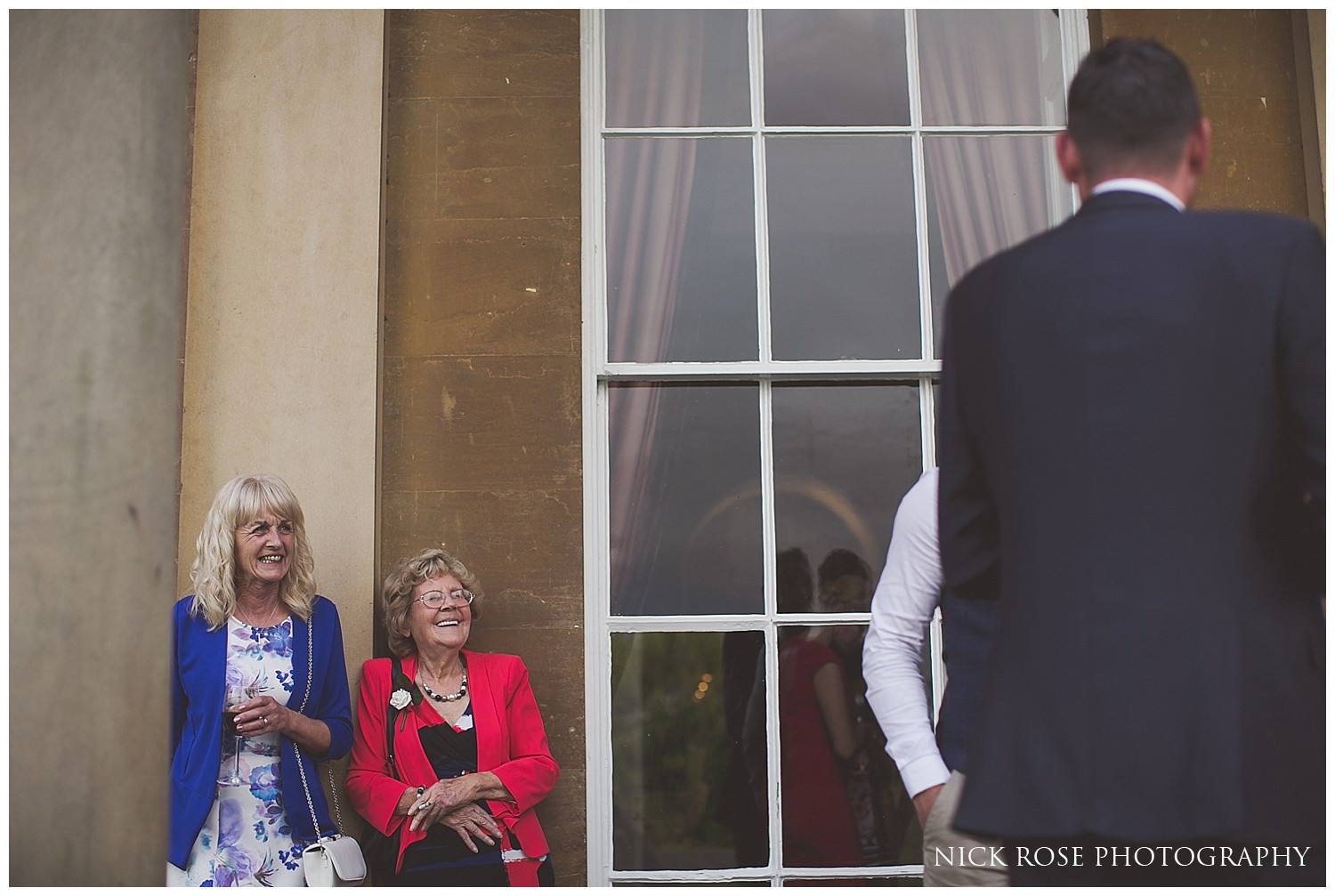  Wedding guests standing outside at Rudding Park Hotel wedding in Harrogate 