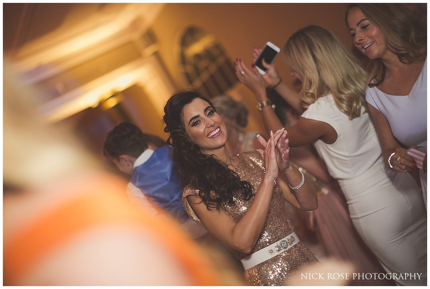  Woman dancing during a beautiful wedding at the Rudding Park Hotel in Harrogate North Yorkshire 