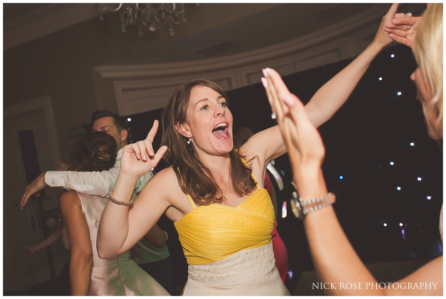  Lady dancing during a wedding reception at the Rudding Park Hotel in Harrogate North Yorkshire 