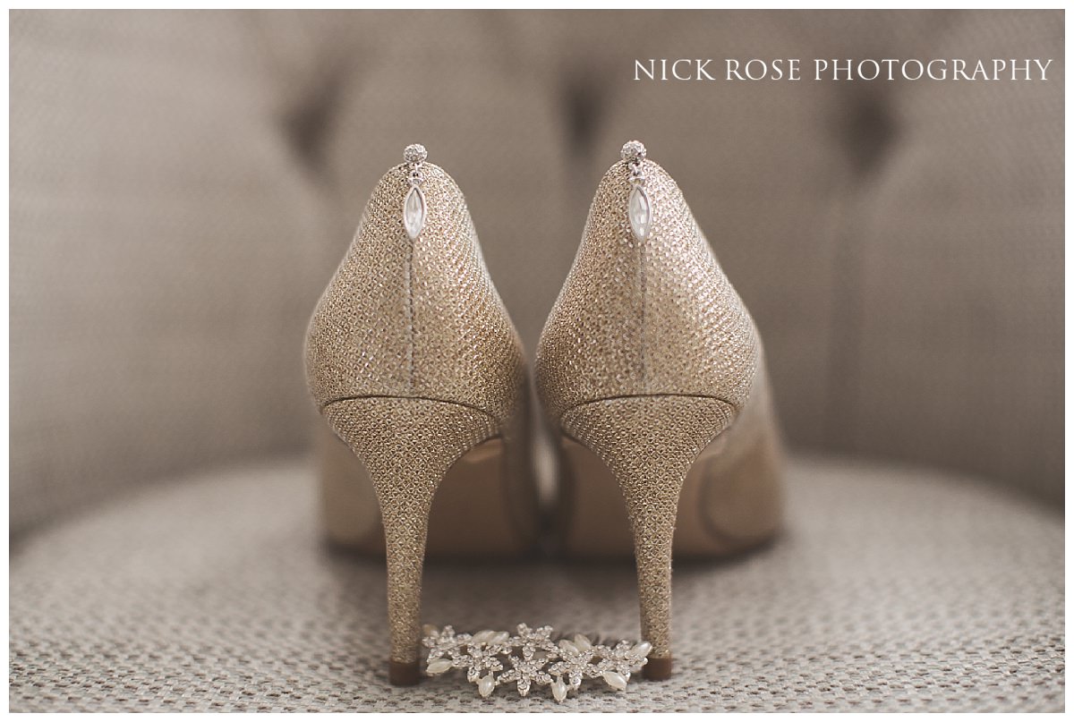  Beautiful Gold Rose wedding shoes on a chair for a Hedsor House in Buckinghamshire 