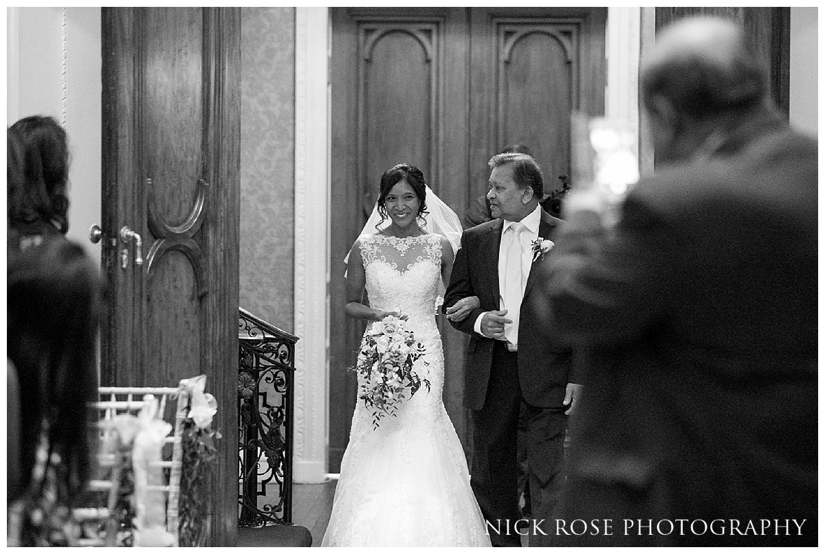 Bride walking down the isle for a Buckinghamshire wedding at Hedsor House 