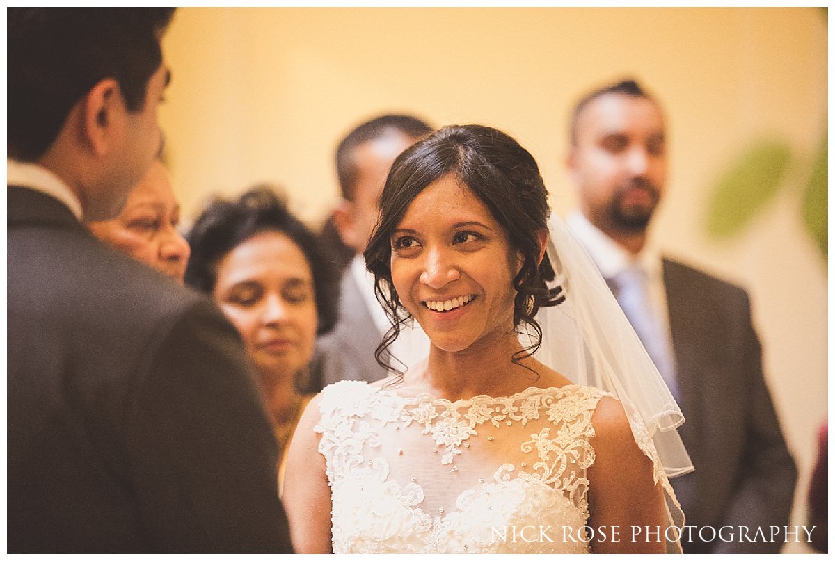  Bride looking at groom during a Hedsor House wedding in Buckinghamshire 