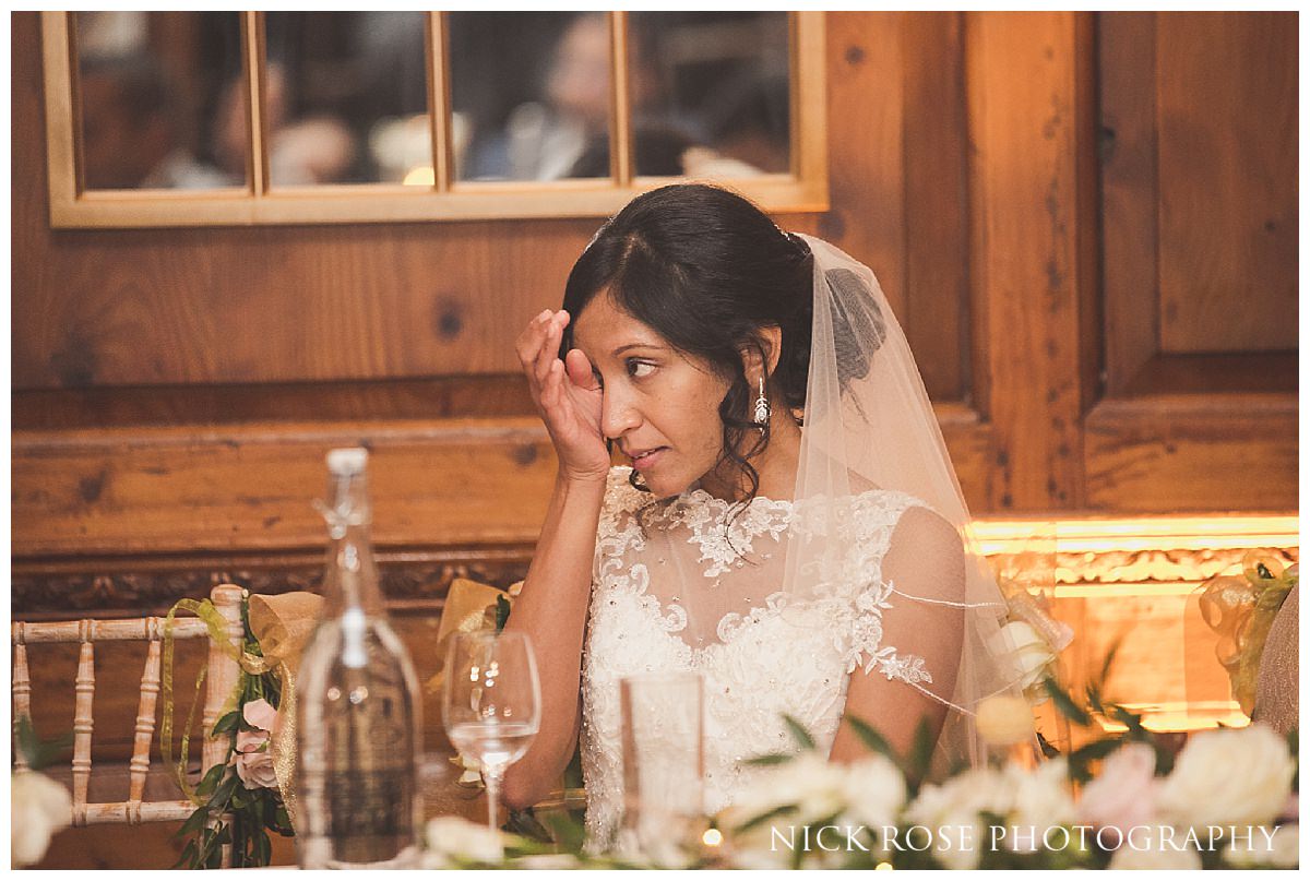  Bride wiping a tear at a Hedsor House wedding in Buckinghamshire 
