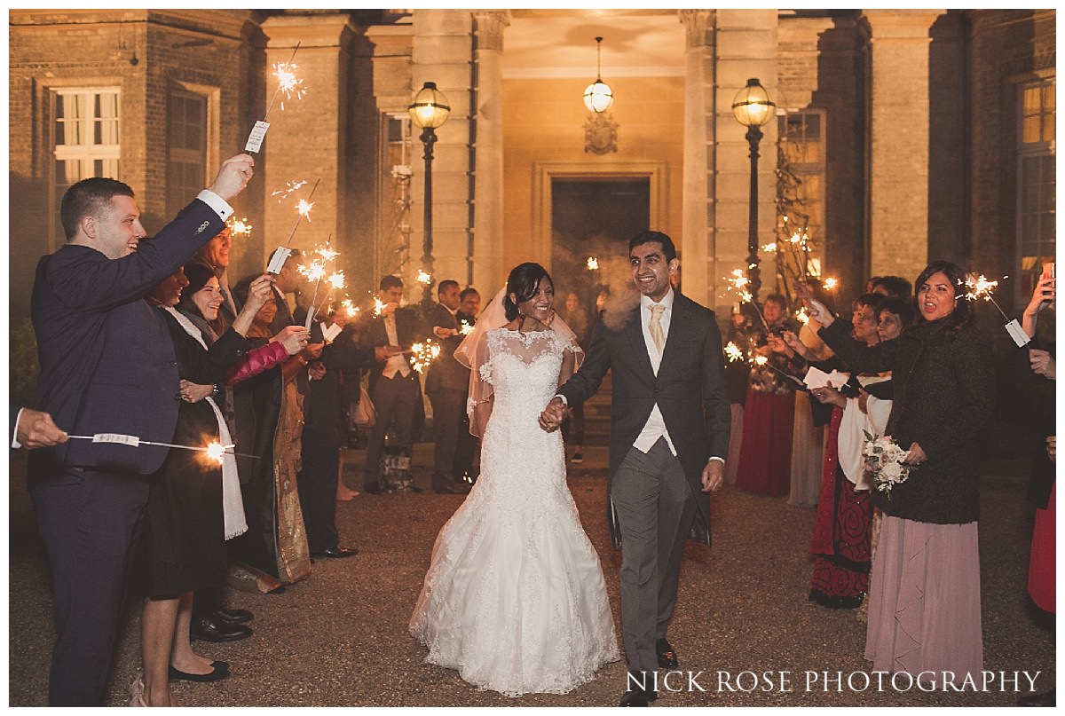  Bride and groom sparkler exit after a Hedsor House wedding reception in Buckinghamshire 
