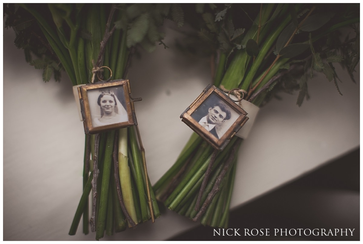  Bridal bouquet with grandparents photographs at Threadneedles Hotel in London 