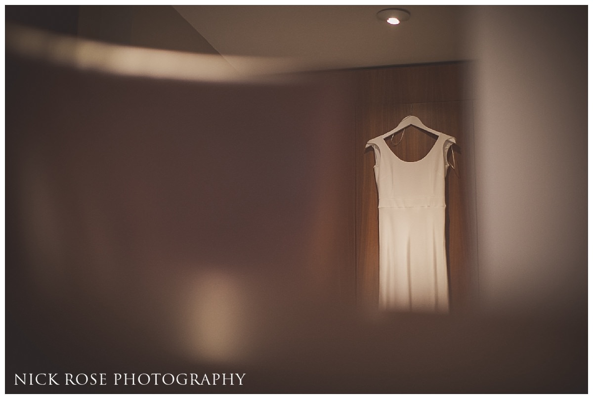  Wedding dress hanging on door at Threadneedles Hotel in London 