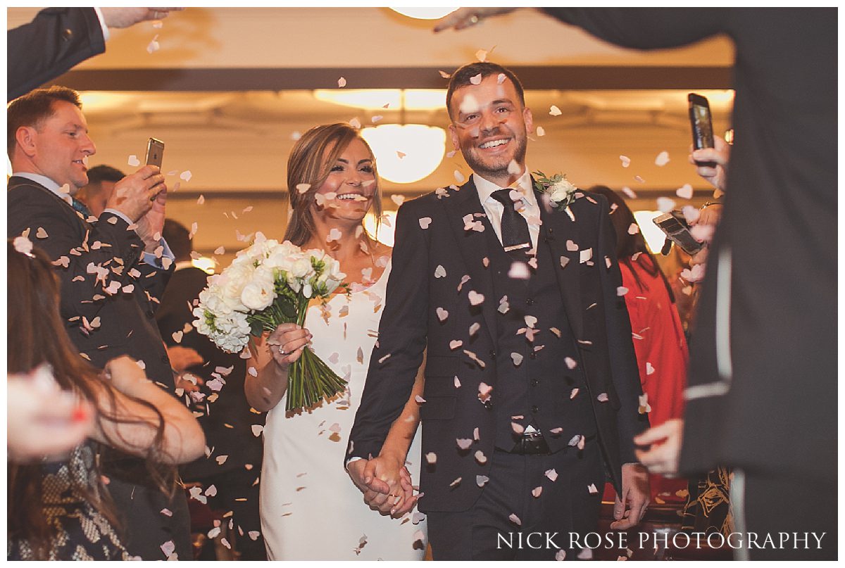  Bride and groom confetti photograph outside Hawksmoor Guildhall 