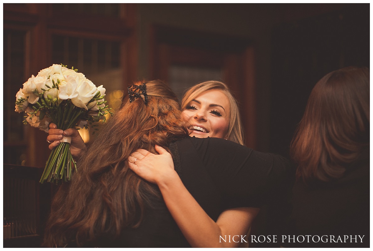  Bride hugging guest after Hawksmoor Guildhall wedding ceremony in London 