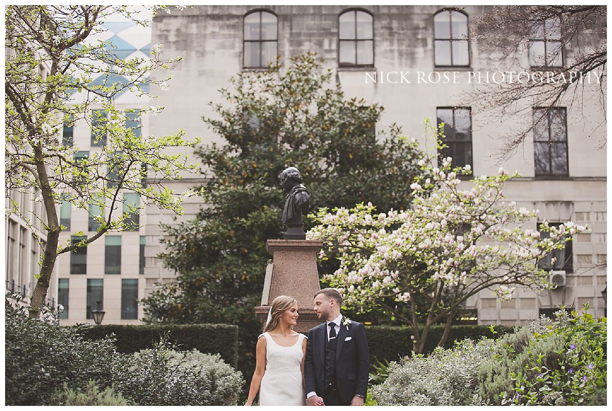  Wedding photograph of the couple during a Guildhall wedding at London's Hawksmoor 