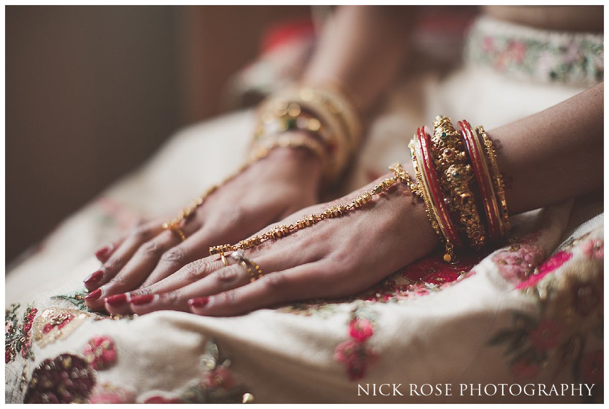  Hindu bride with hands on her lap before her wedding ceremony at the grove 