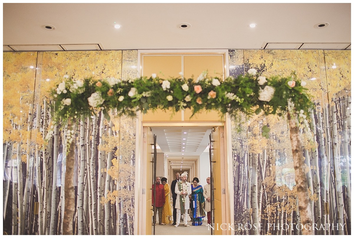  Hindu wedding ceremony entrance by the groom and his family in the Amber room at the Grove hotel 