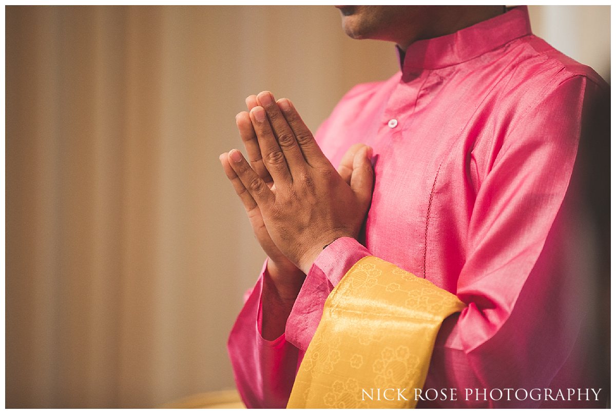  Hindu wedding priest Kamal Pandey praying during the wedding ceremony 
