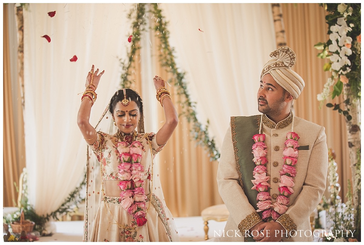  Hindu bride throwing rice after her wedding ceremony at The Grove 