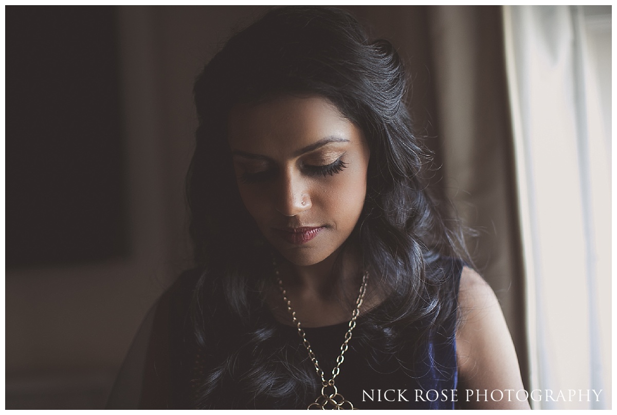  Indian bride getting ready for a Hindu reception at The Grove in Hertfordshire 