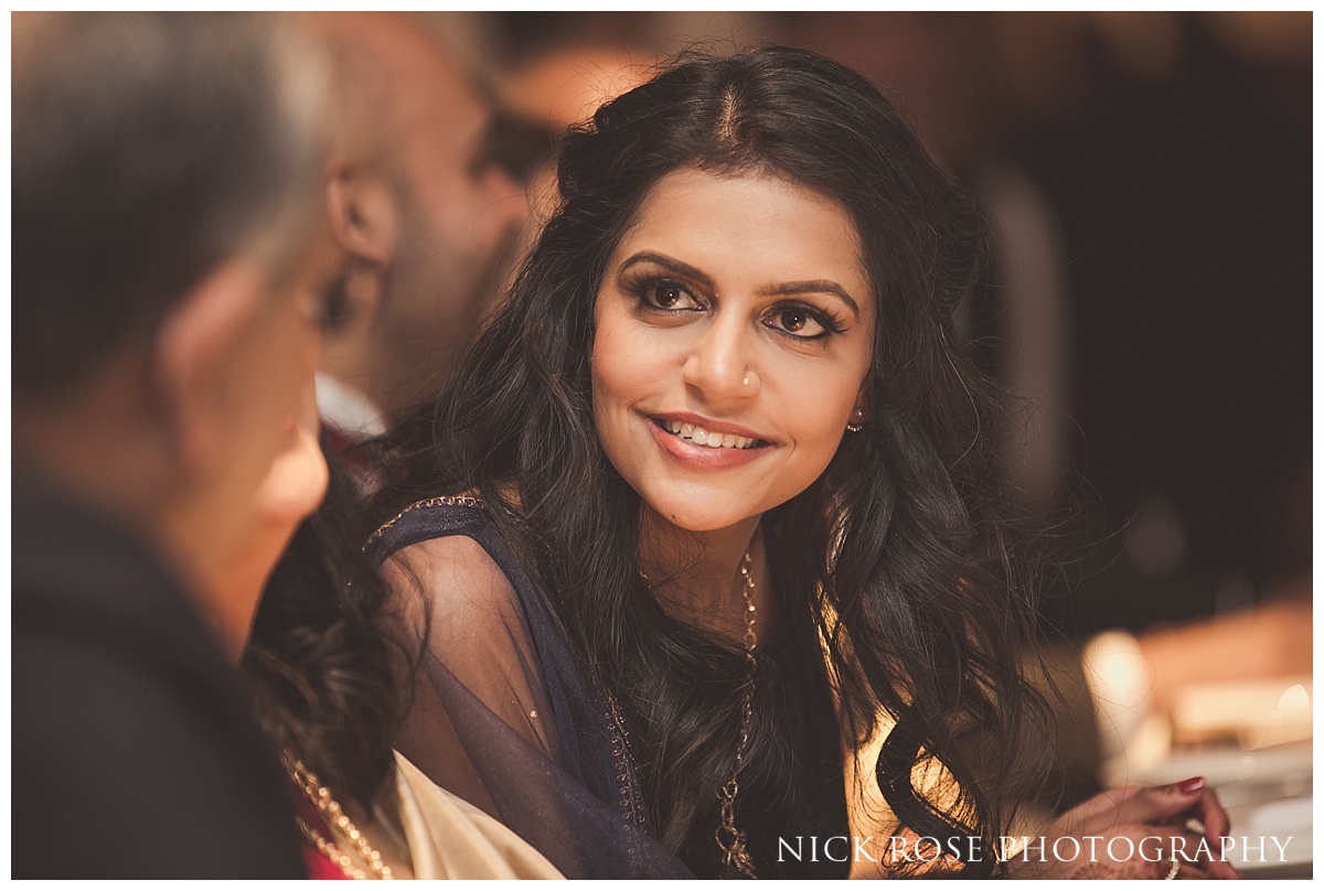  Bride smiling at Hindu wedding reception at The Grove in Chandler's Cross in Watford 