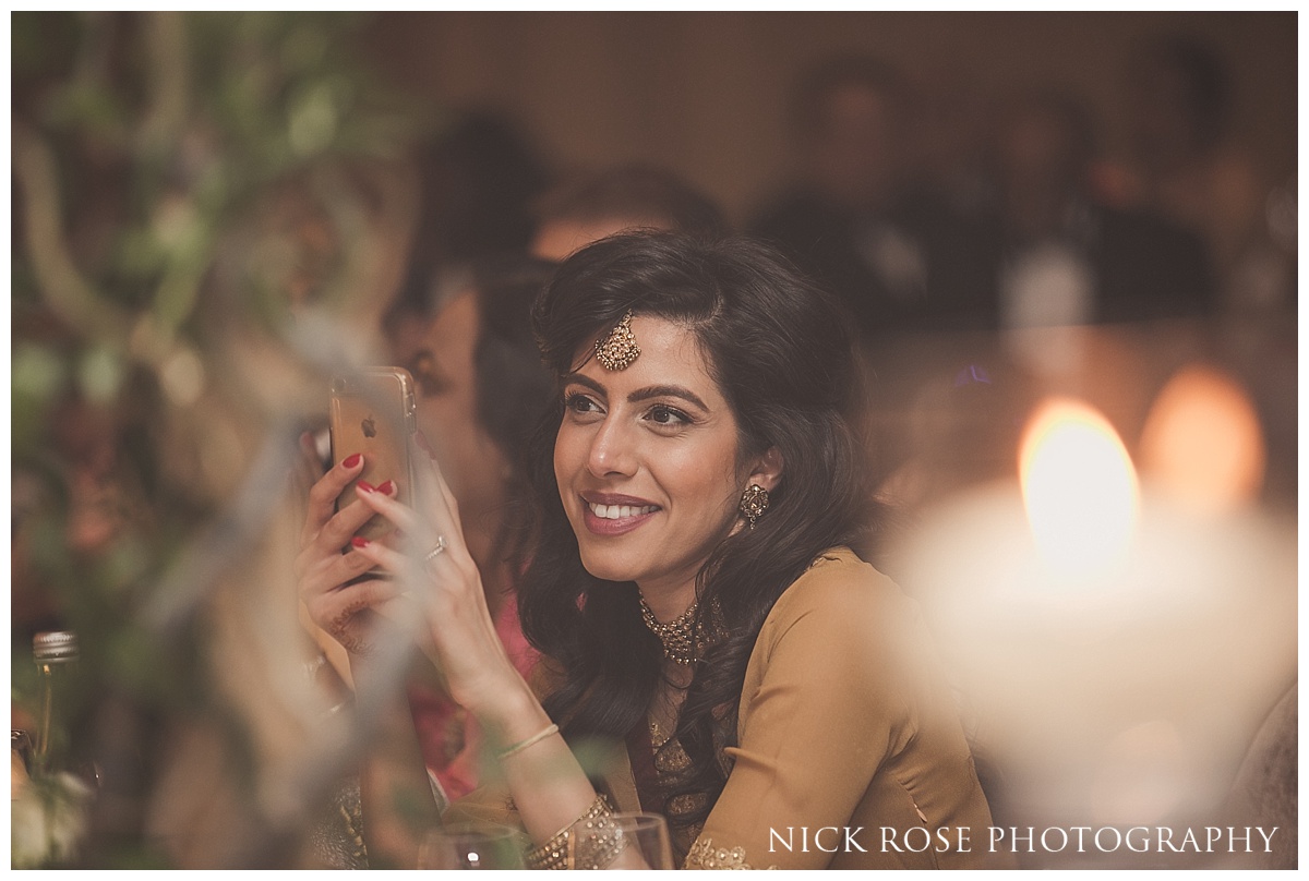 Guests watching wedding speeches at The Grove in Watford