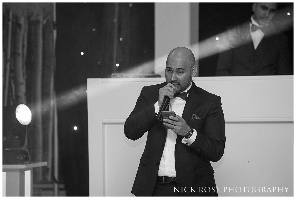  Guests watching wedding speeches at The Grove in Watford 