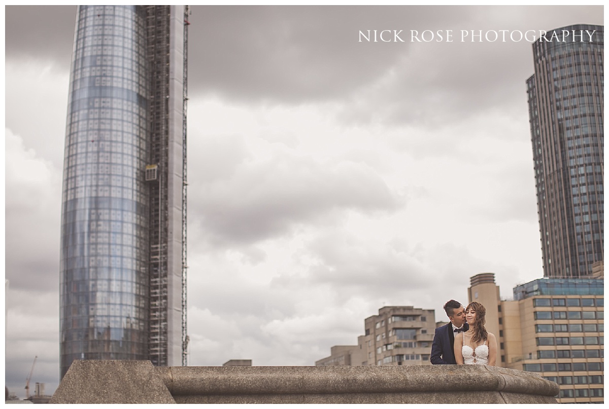  Engagement photography on a bridge over the River Thames in London 