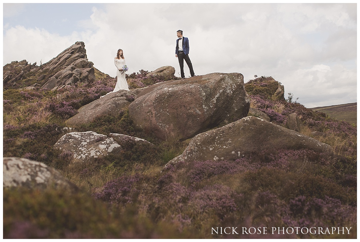  Pre wedding bride and groom standing on Ramshaw Rocks in the Peak District 