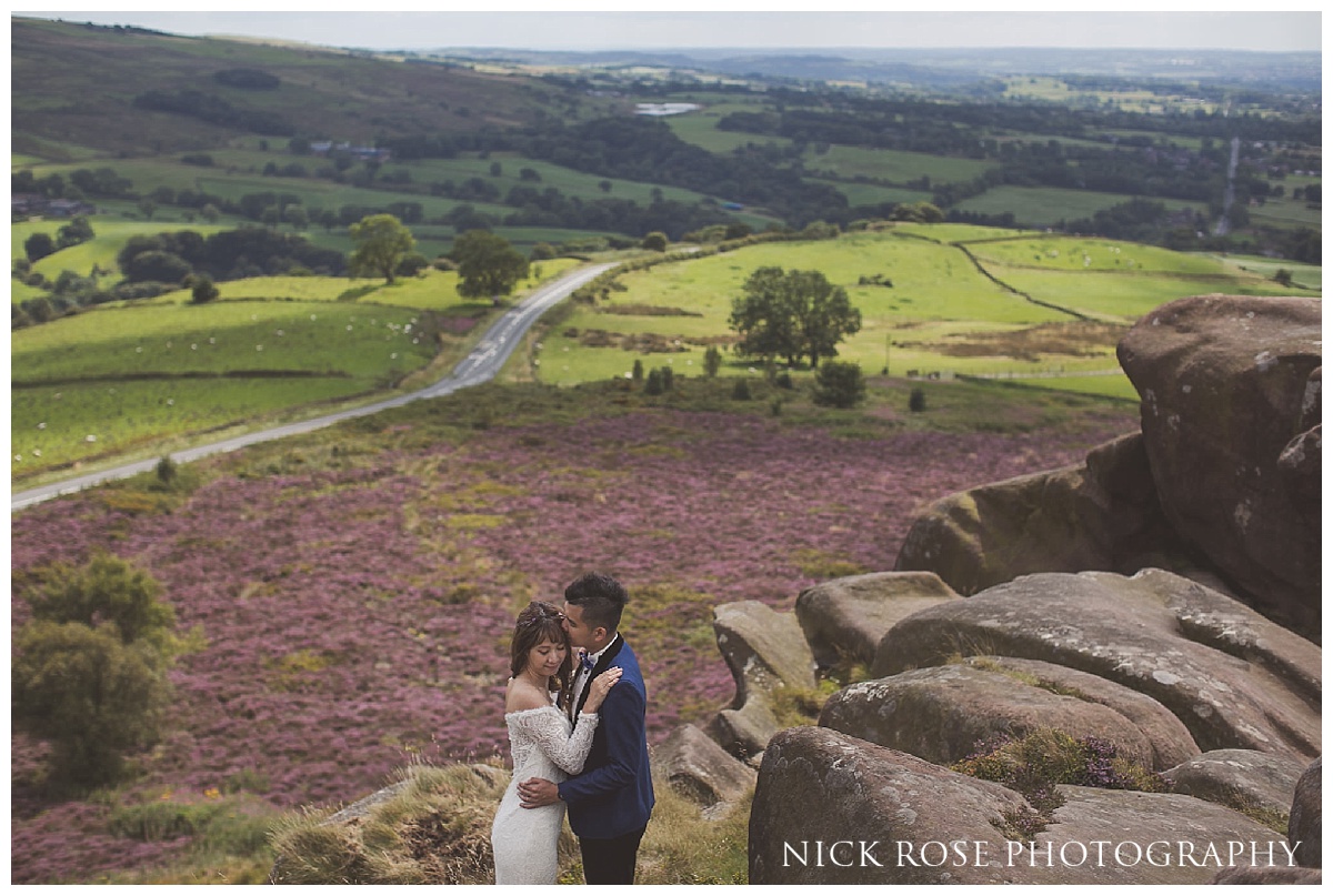 Pre wedding bride and groom standing on Ramshaw Rocks in the Peak District