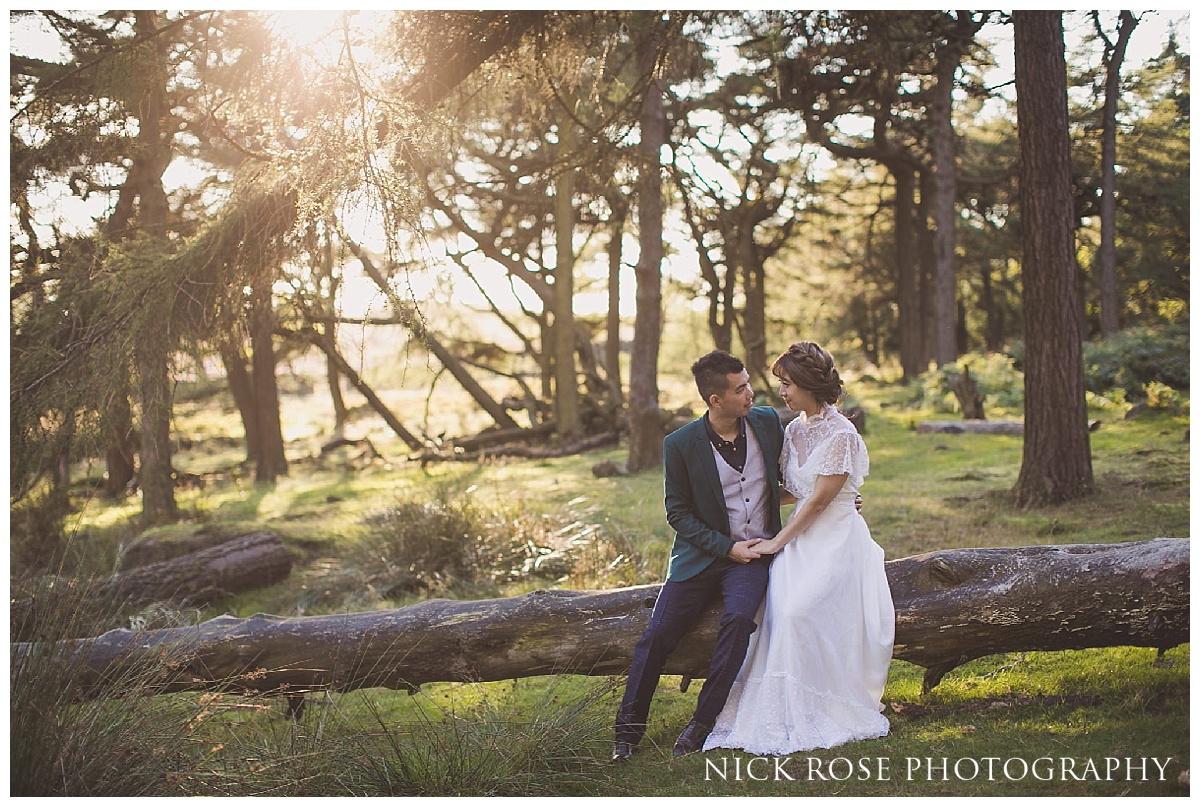  Pre wedding photography couple sitting on a fallen tree at sunset at the Roaches in the Peak District  