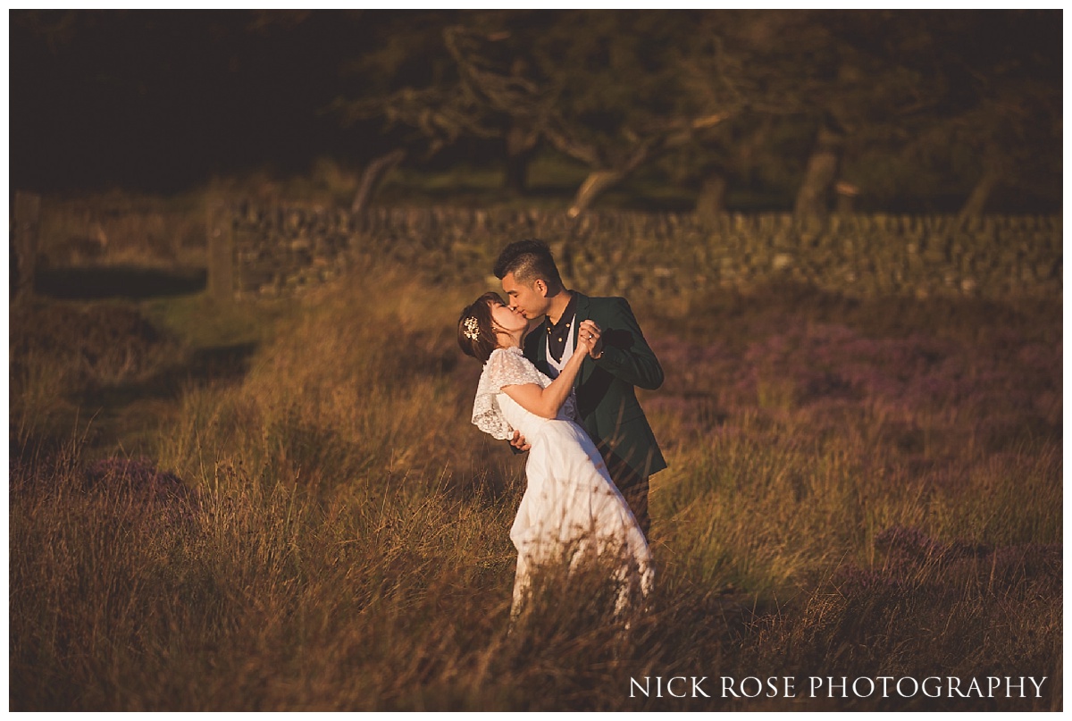 Couple from Hong Kong dancing during a sunset pre wedding photography shoot in the Peak District