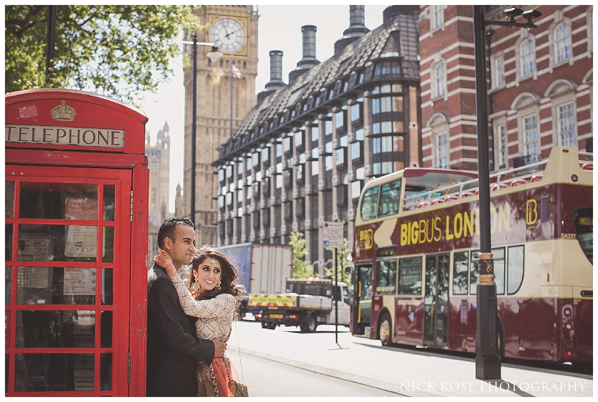  Asian pre wedding photography by red phone boxes in front of Big Ben in London 
