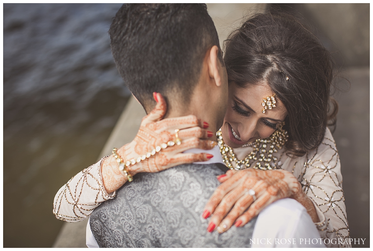  South Asian bride with her arms around Pakistani Groom for a pre wedding photography shoot in London 