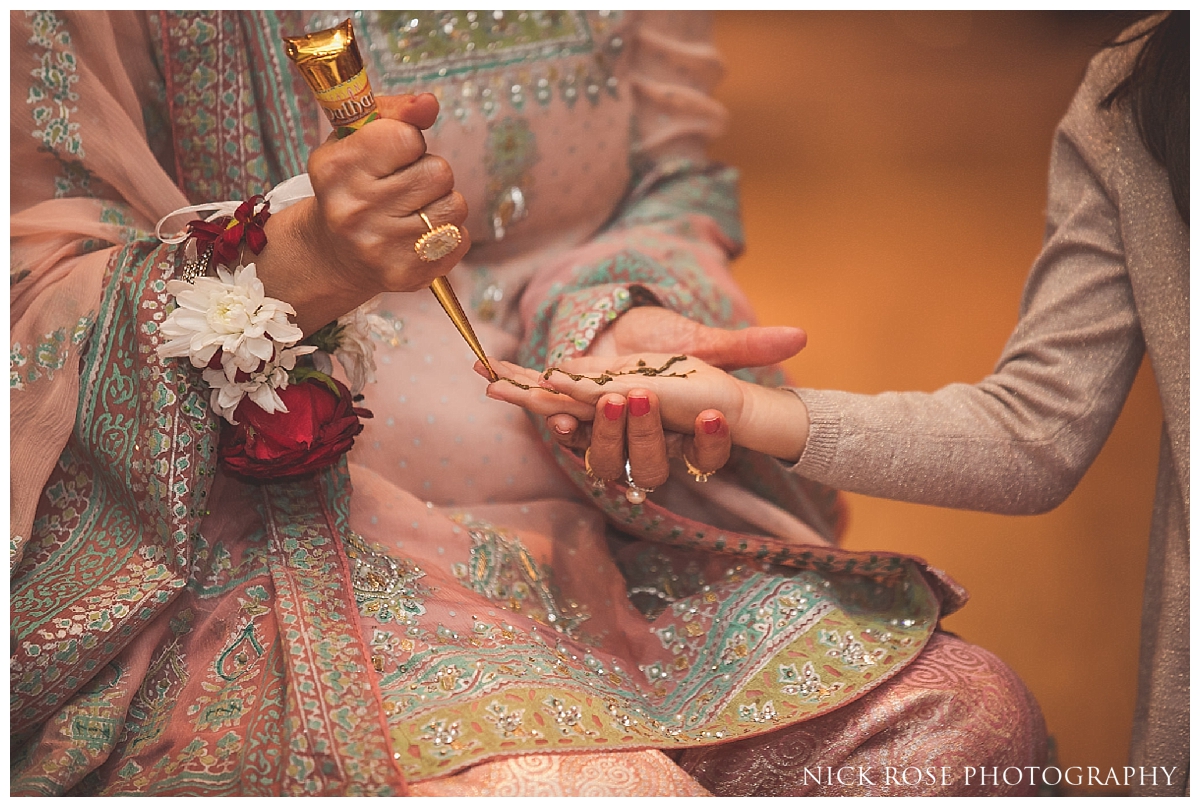  Henna being put on guests hands during a Pakistani wedding event at the Sheraton Grand in Park Lane 