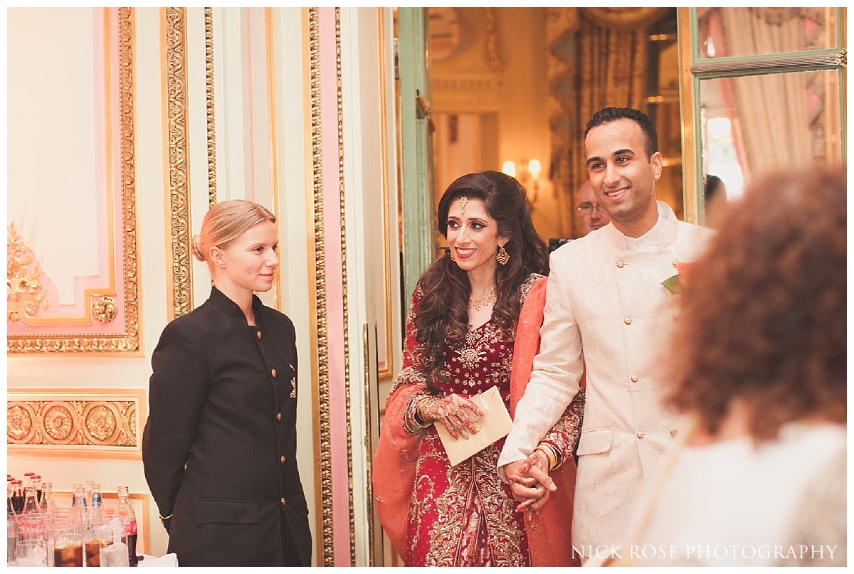Bride and groom entering the Marie Antoinette Suite in the Ritz London