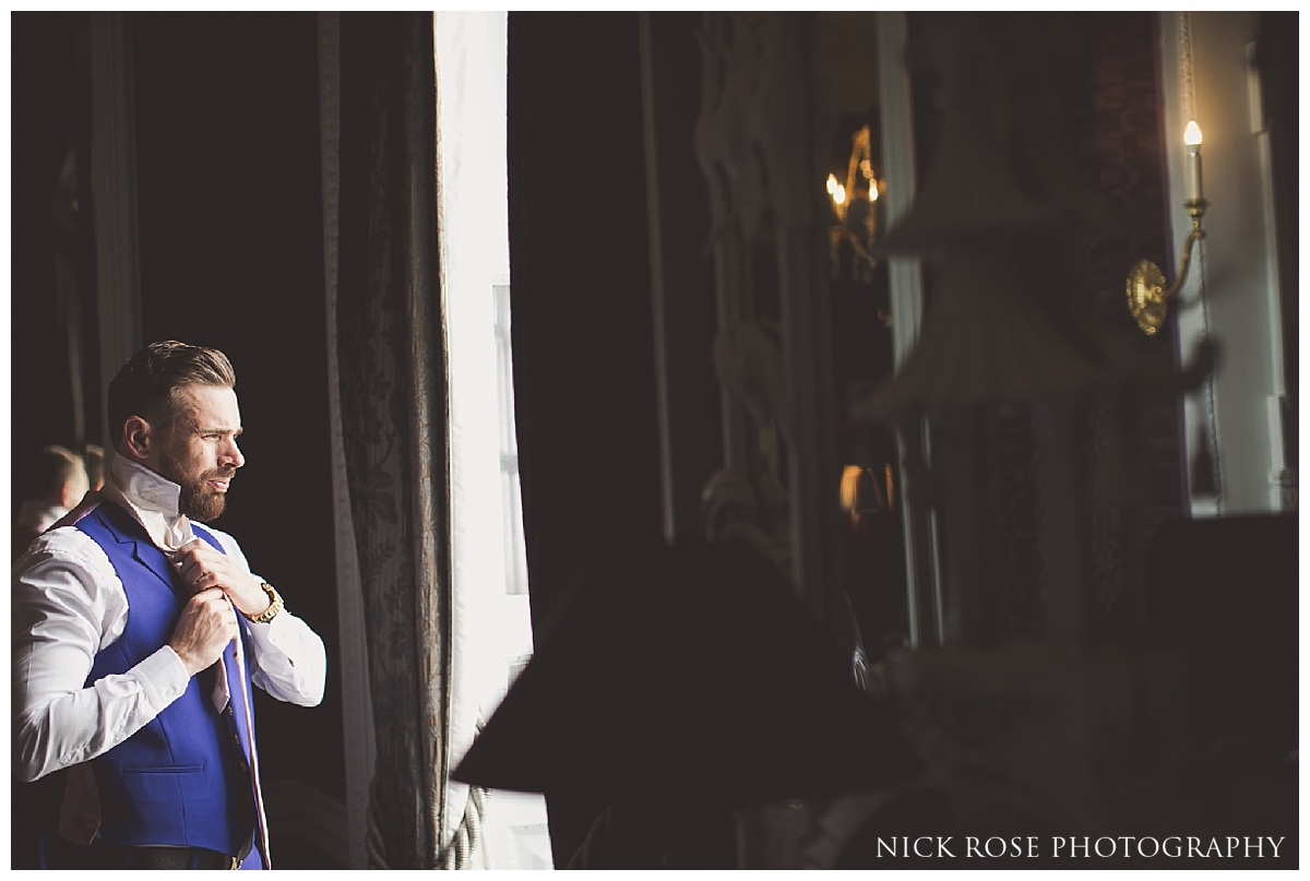 Groom preparation for a Buxted Park hotel wedding in East Sussex