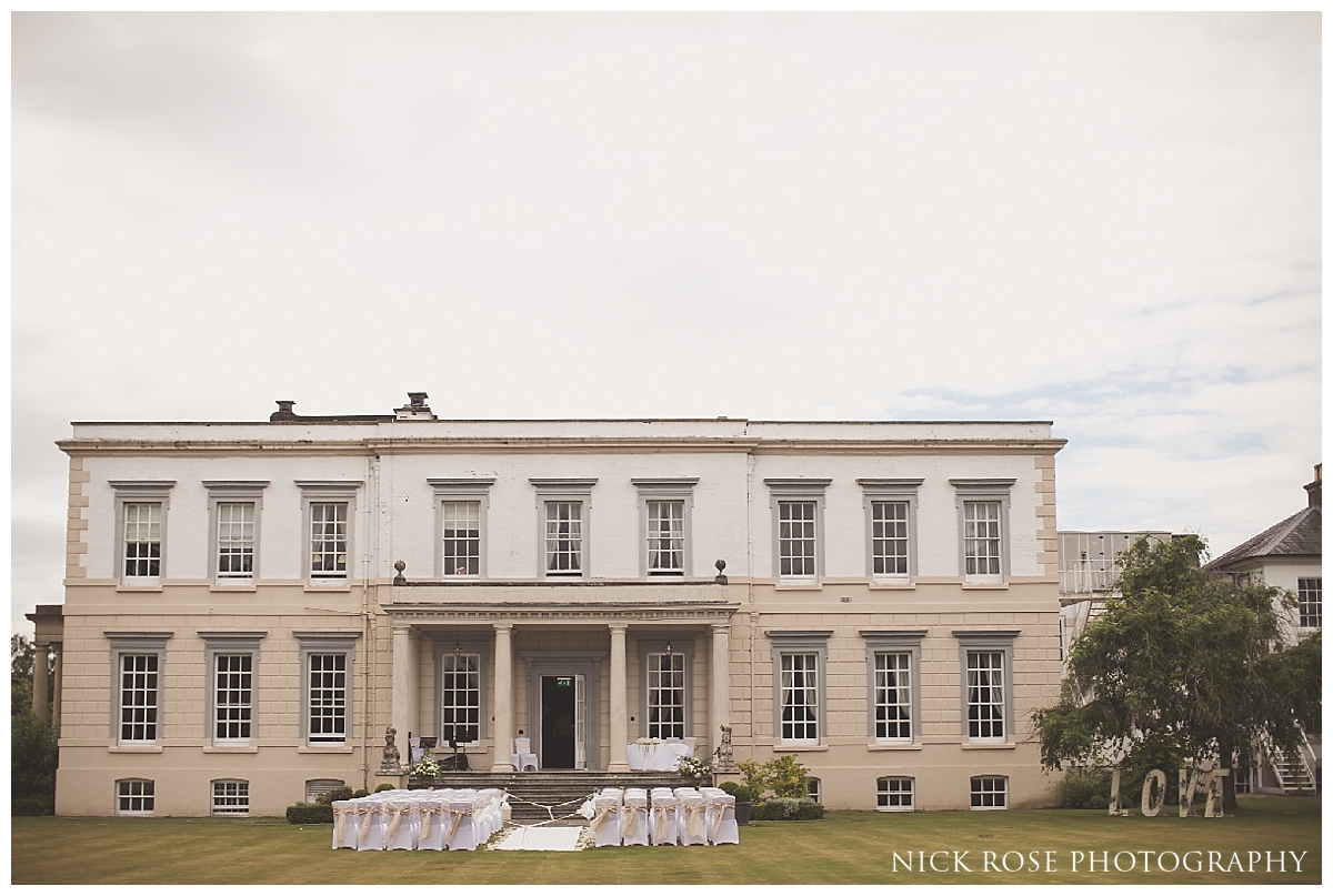  Outdoor wedding ceremony at Buxted Park in East Sussex 