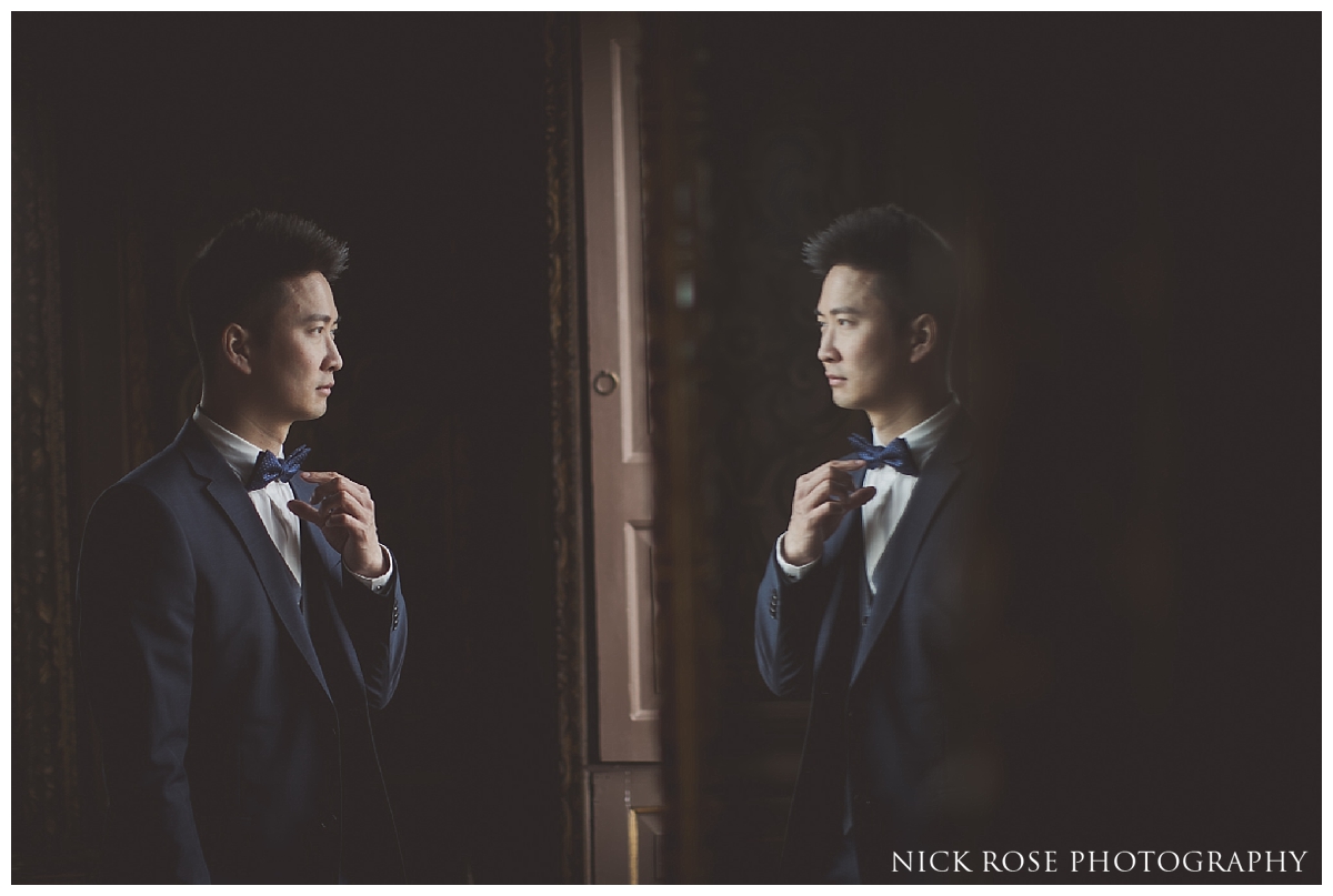  Groom getting ready for his wedding at the Little Banqueting House at Hampton Court Palace 