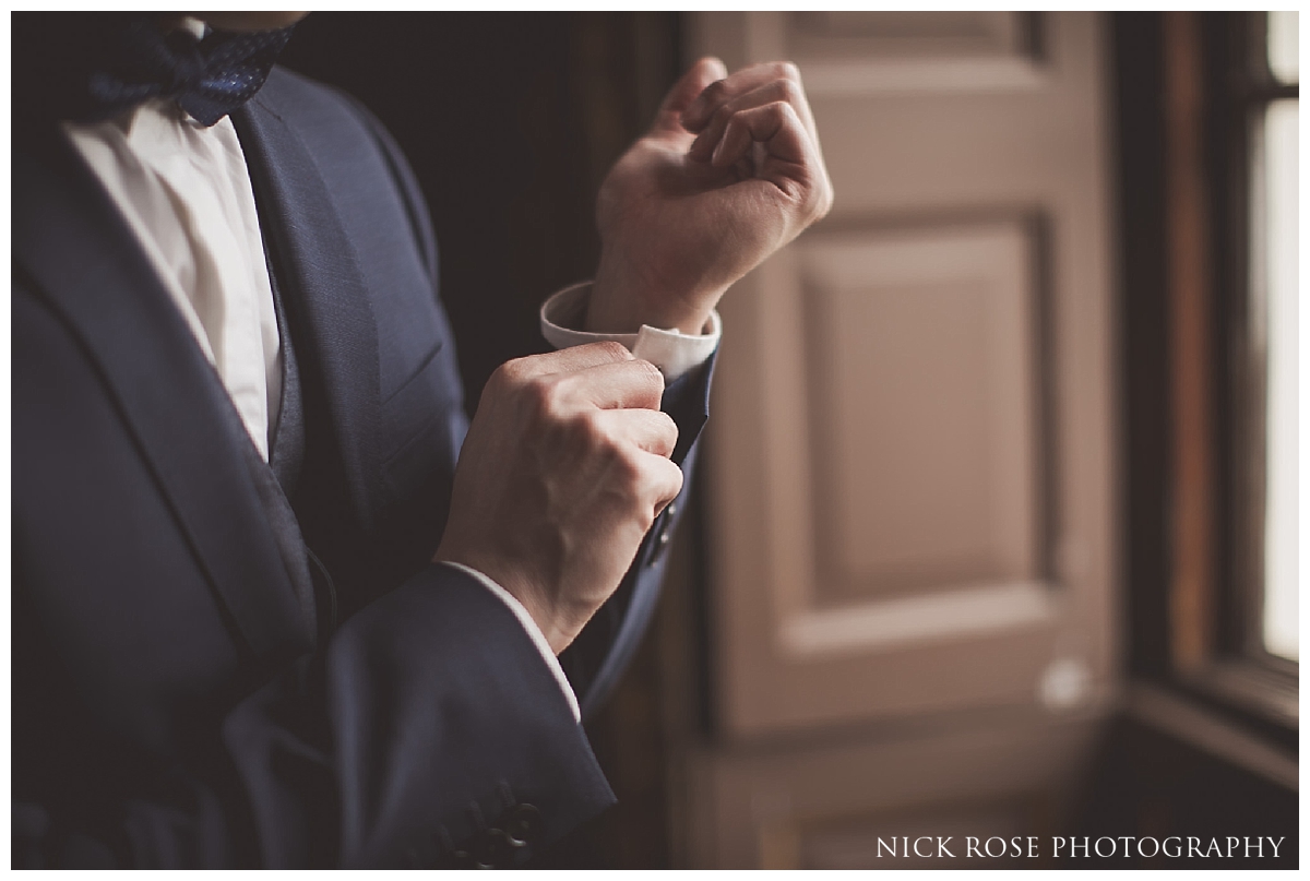  Groom getting ready for his wedding at the Little Banqueting House at Hampton Court Palace 