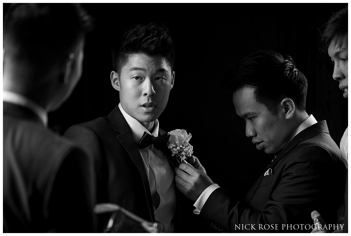  Groomsmen getting ready for his wedding at the Little Banqueting House at Hampton Court Palace 