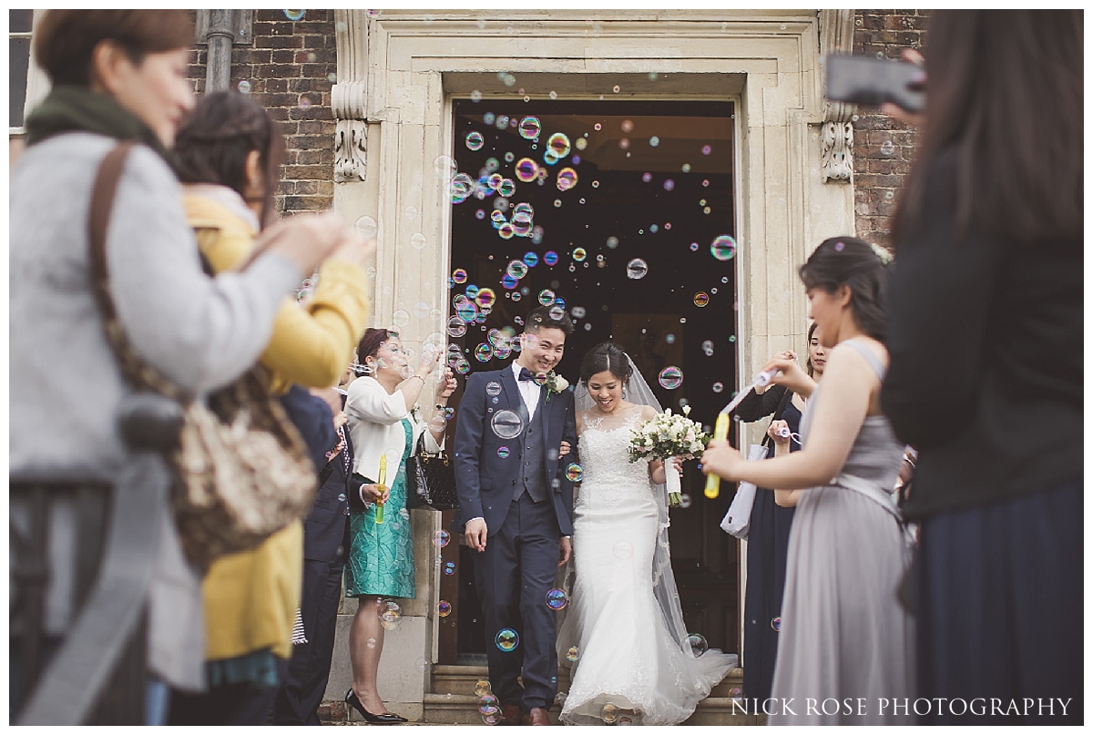  Bride and groom bubble confetti photograph at Hampton Court Palace 