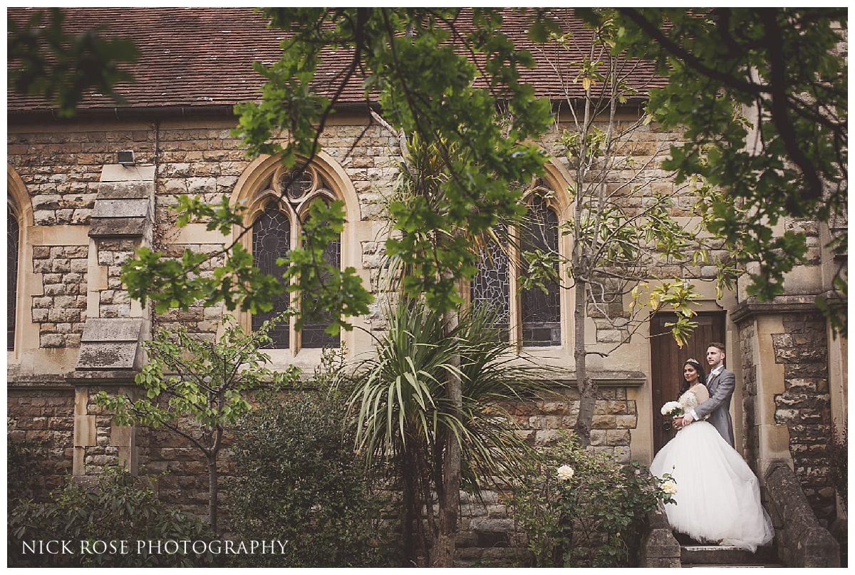  Bride and groom wedding photography portraits after a Catholic wedding ceremony at St Mary Magdalene Church in Enfield London 