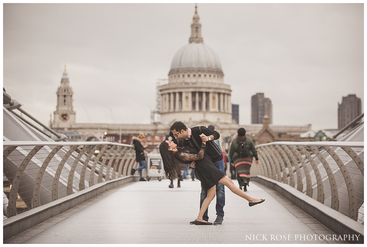Pre wedding photography shoot on Millennium Bridge London in front of St Pauls Cathedral