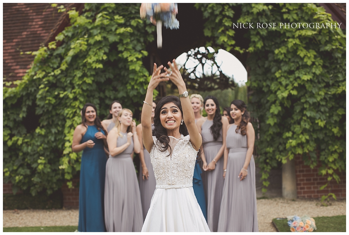 Bride throwing bouquet at The Dairy in Aylesbury