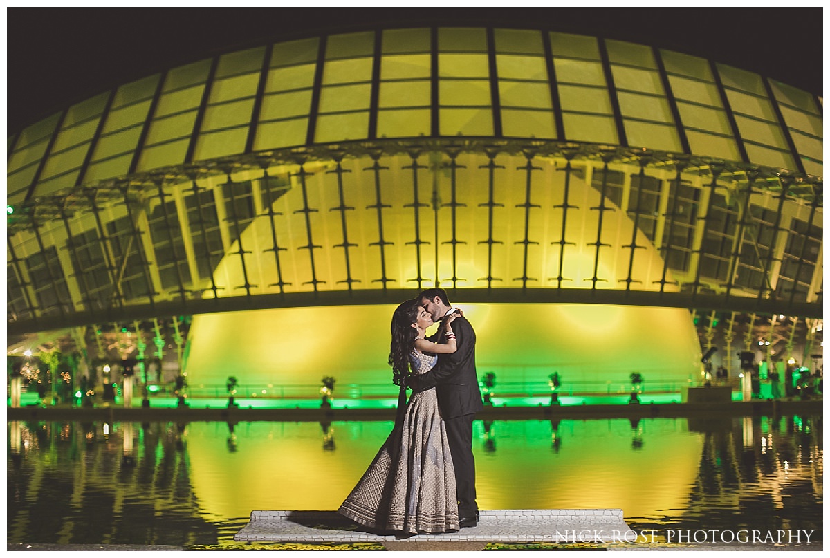  Destination wedding photography portrait in front of the eye of The Hemisfèric in the City of Arts in Valencia, Spain 