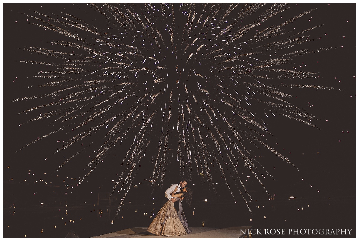  First dance fireworks display during a destination Sikh wedding at The Hemisfèric, City of Arts in Valencia, Spain 