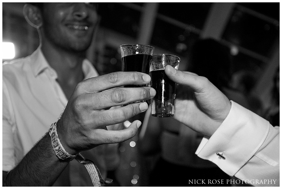  Guests doing shots during a destination wedding in Valencia Spain 