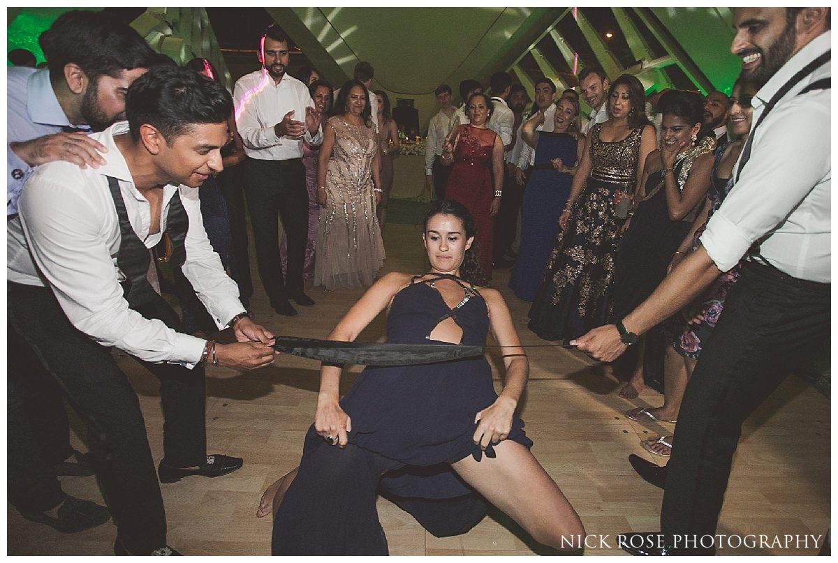  Limbo dancing at a destination wedding at The Hemisferic in Valencia Spain 