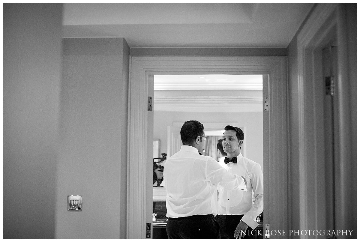  Groom and ushers getting ready for a Savoy London wedding in the UK 