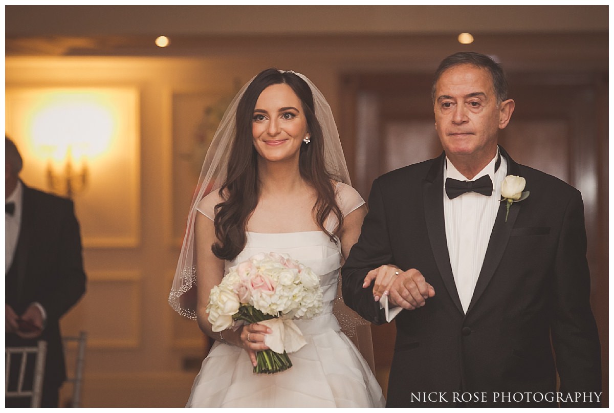 Bride walking down the Isle in the Abraham Lincoln room in the Savoy London
