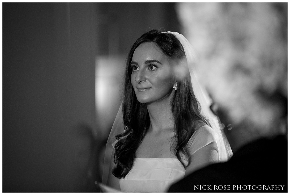 Groom looking at bride during a Savoy London wedding ceremony